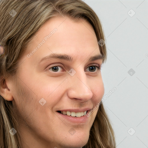 Joyful white young-adult female with long  brown hair and blue eyes