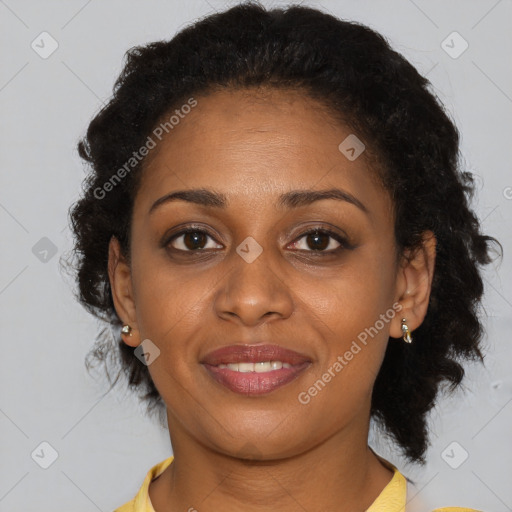 Joyful black young-adult female with medium  brown hair and brown eyes