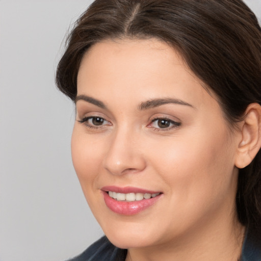 Joyful white young-adult female with medium  brown hair and brown eyes