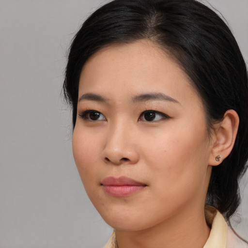 Neutral asian young-adult female with medium  black hair and brown eyes