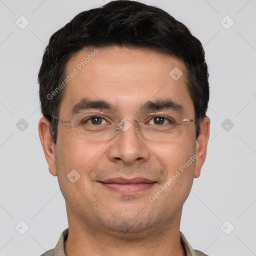 Joyful white young-adult male with short  black hair and brown eyes