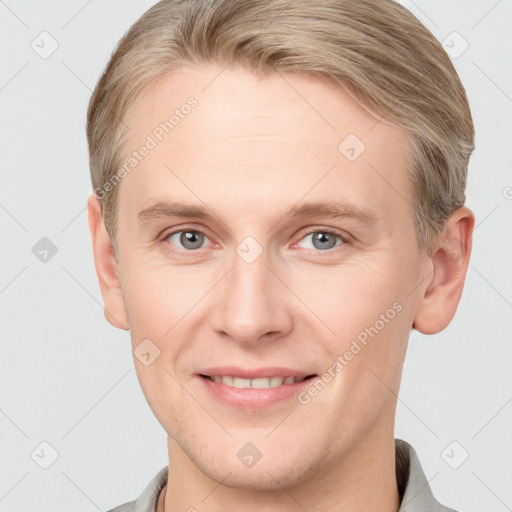 Joyful white adult male with short  brown hair and grey eyes