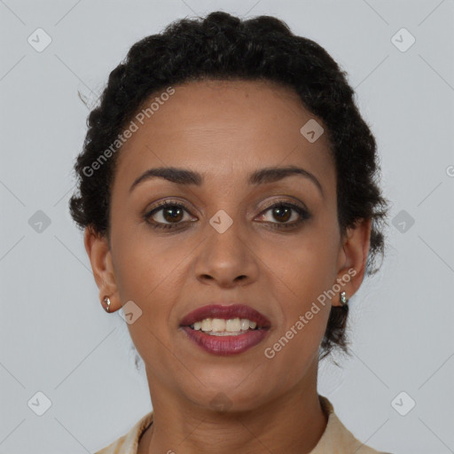 Joyful black young-adult female with short  brown hair and brown eyes