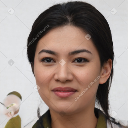 Joyful asian young-adult female with medium  black hair and brown eyes