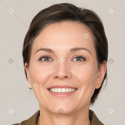 Joyful white young-adult female with medium  brown hair and grey eyes