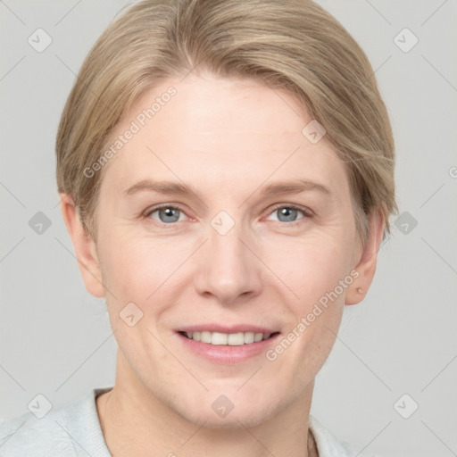 Joyful white adult female with short  brown hair and grey eyes