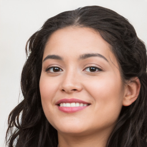 Joyful white young-adult female with long  black hair and brown eyes