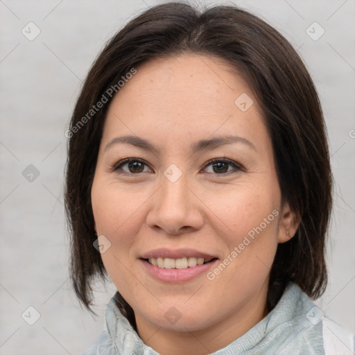 Joyful white adult female with medium  brown hair and brown eyes