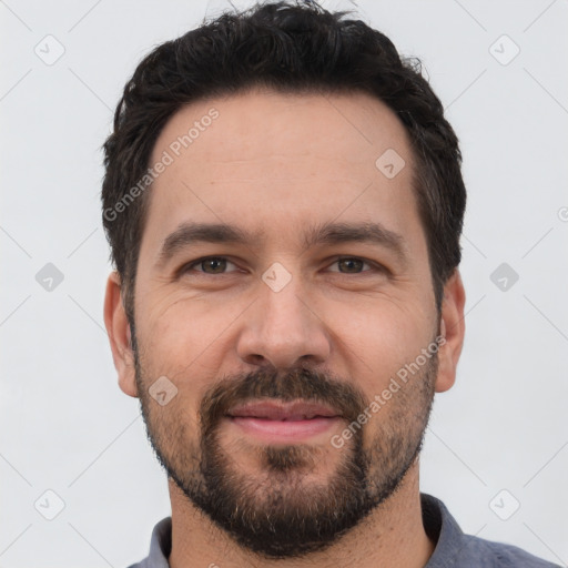 Joyful white young-adult male with short  black hair and brown eyes