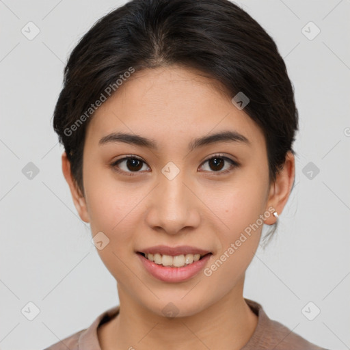 Joyful asian young-adult female with short  brown hair and brown eyes