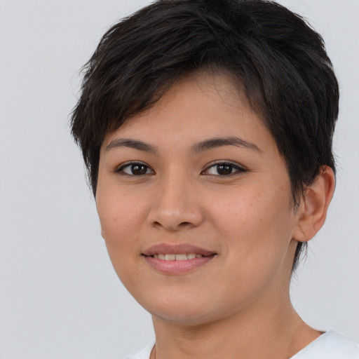 Joyful asian young-adult female with short  brown hair and brown eyes