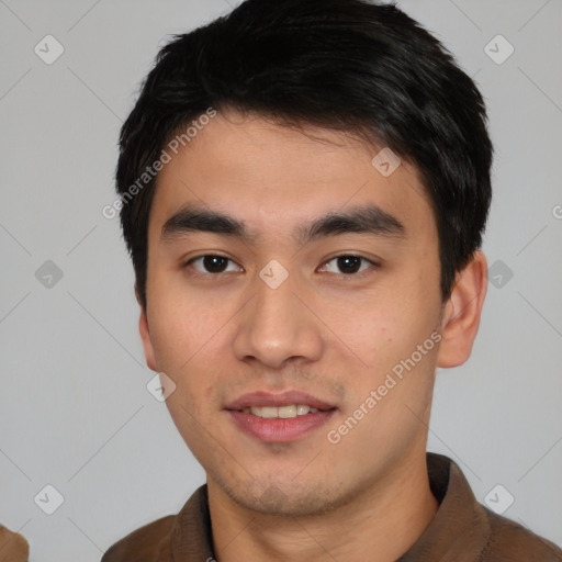 Joyful asian young-adult male with short  black hair and brown eyes