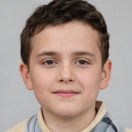 Joyful white child male with short  brown hair and brown eyes