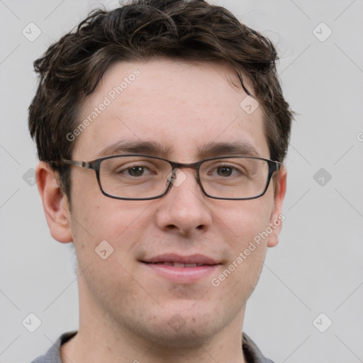 Joyful white adult male with short  brown hair and grey eyes