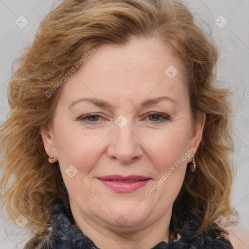 Joyful white adult female with medium  brown hair and blue eyes