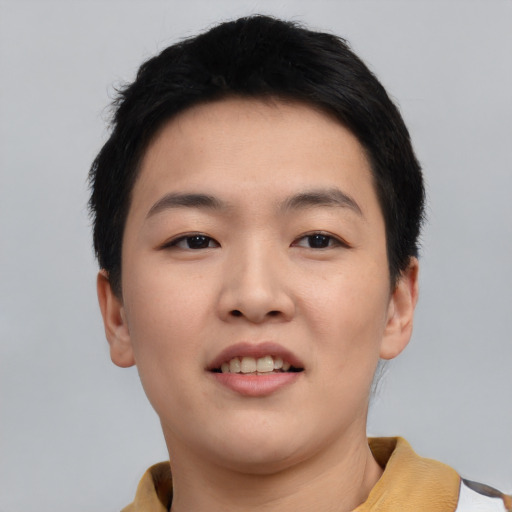 Joyful asian young-adult female with short  black hair and brown eyes