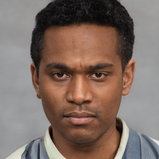 Neutral latino young-adult male with short  black hair and brown eyes
