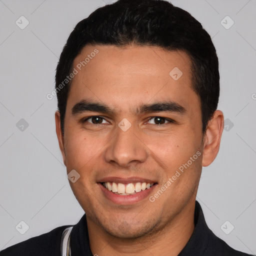 Joyful white young-adult male with short  black hair and brown eyes