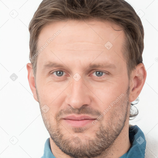 Joyful white adult male with short  brown hair and grey eyes