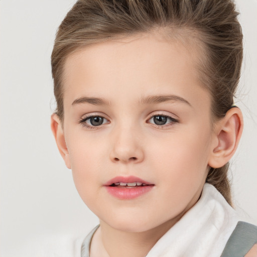 Joyful white child female with short  brown hair and brown eyes