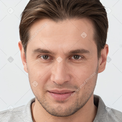 Joyful white young-adult male with short  brown hair and brown eyes