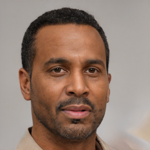 Neutral latino adult male with short  black hair and brown eyes