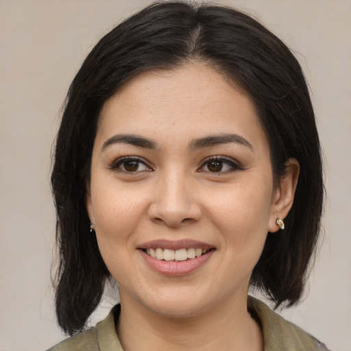 Joyful white young-adult female with medium  brown hair and brown eyes