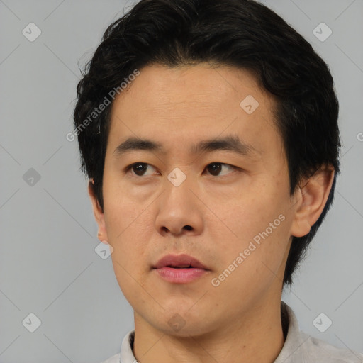 Neutral asian young-adult male with short  black hair and brown eyes