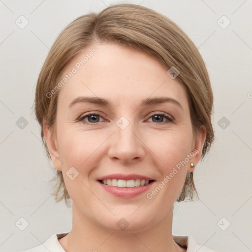 Joyful white young-adult female with medium  brown hair and grey eyes