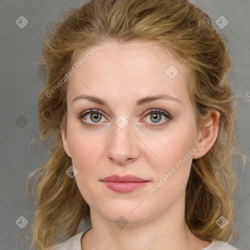 Joyful white young-adult female with medium  brown hair and blue eyes