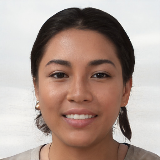 Joyful white young-adult female with medium  black hair and brown eyes