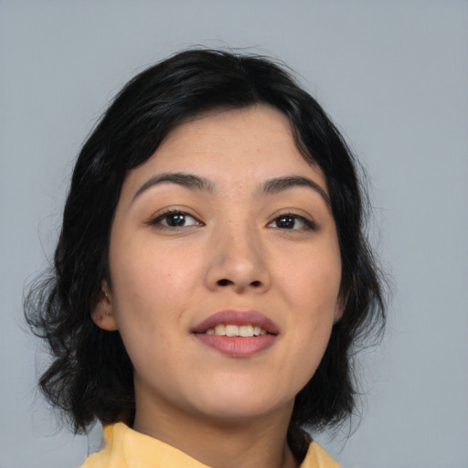Joyful asian young-adult female with medium  black hair and brown eyes