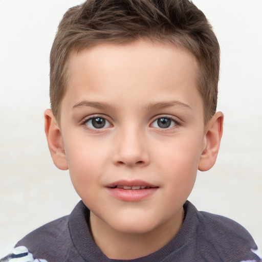 Joyful white child male with short  brown hair and brown eyes