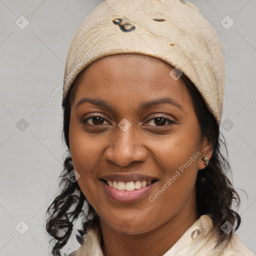 Joyful black young-adult female with medium  brown hair and brown eyes