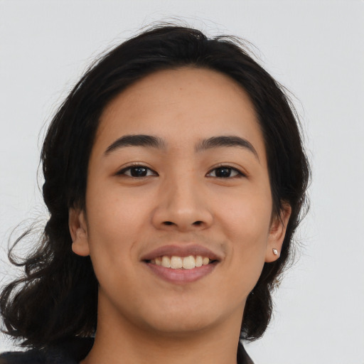 Joyful asian young-adult female with medium  brown hair and brown eyes