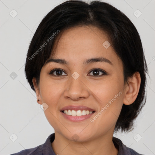 Joyful asian young-adult female with medium  brown hair and brown eyes