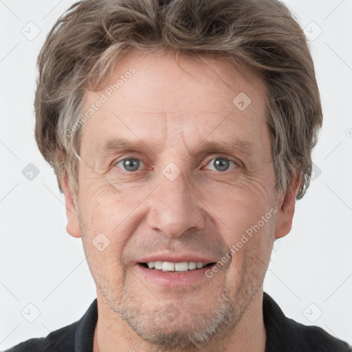 Joyful white adult male with short  brown hair and grey eyes