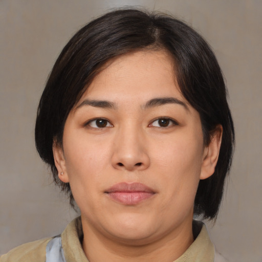 Neutral asian young-adult female with medium  brown hair and brown eyes