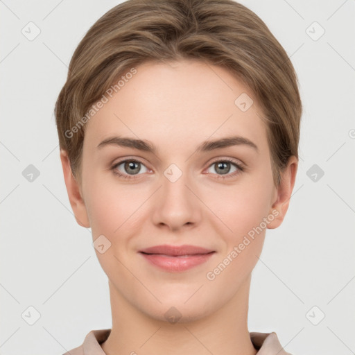 Joyful white young-adult female with short  brown hair and grey eyes