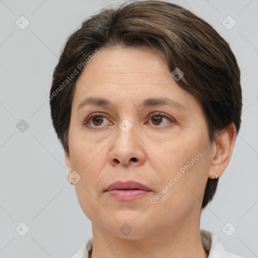 Joyful white adult female with short  brown hair and brown eyes