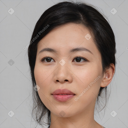 Joyful asian young-adult female with medium  black hair and brown eyes