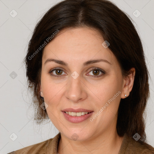 Joyful white adult female with medium  brown hair and brown eyes