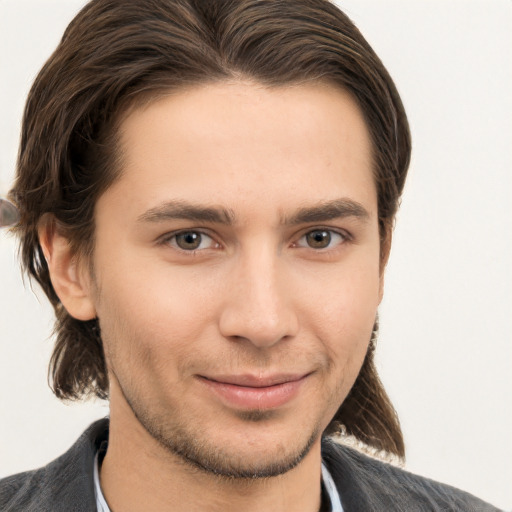 Joyful white young-adult male with medium  brown hair and brown eyes