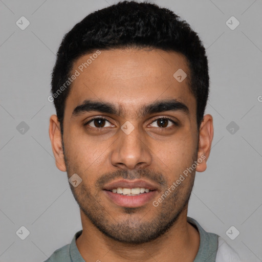 Joyful latino young-adult male with short  black hair and brown eyes