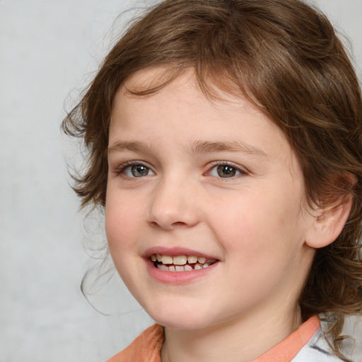 Joyful white child female with medium  brown hair and blue eyes