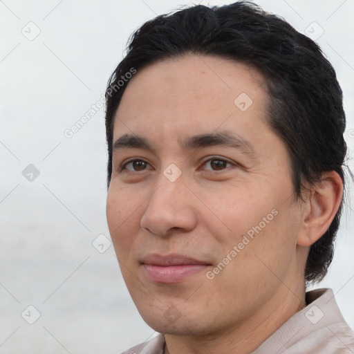 Joyful white adult male with short  black hair and brown eyes