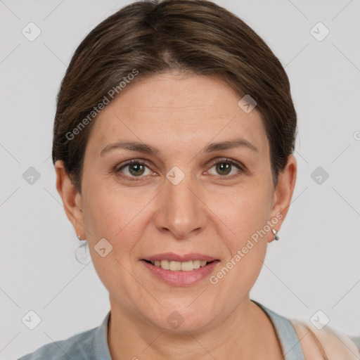 Joyful white adult female with short  brown hair and grey eyes