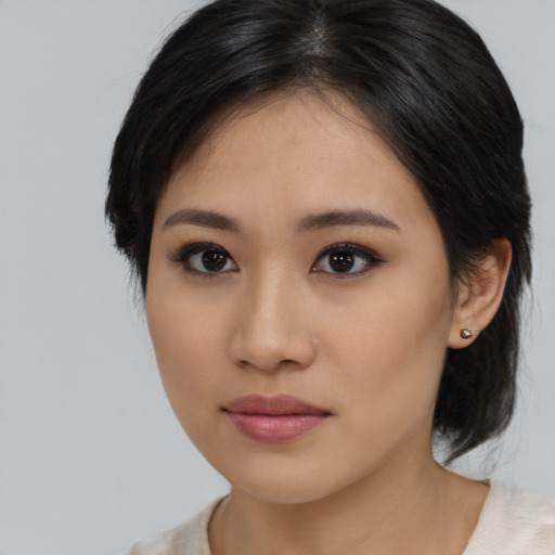 Neutral asian young-adult female with medium  black hair and brown eyes