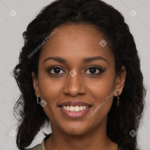 Joyful black young-adult female with long  brown hair and brown eyes