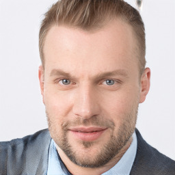 Joyful white adult male with short  brown hair and blue eyes